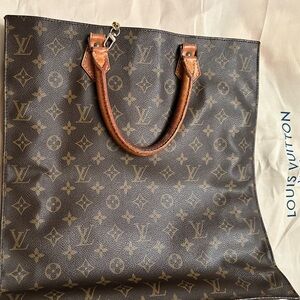 Louis Vuitton Brown Leather Women's Flat bag. Comes with gold shoulder strap.